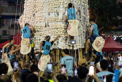 Crowds flock to celebrate the century-old Bun Festival in Hong Kong