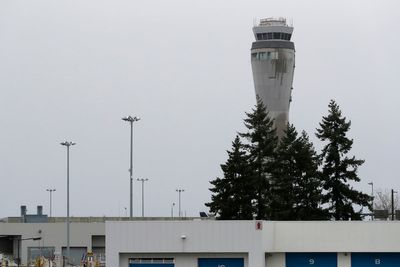 Police search for fugitive who escaped from Seattle's airport in handcuffs