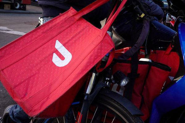 New York official charged in shooting of DoorDash delivery driver who was lost