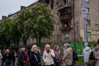 A Russian missile and drone attack kills 2 people in Ukraine's capital