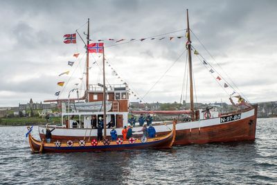 ‘Shetland Bus’ convoy greeted with floating salute as it arrives in Lerwick