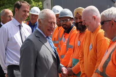 King jokes with workers during visit to London’s super sewer