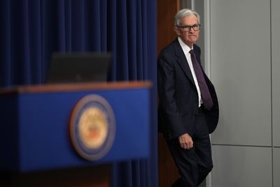 Stocks close slightly higher as Fed stands pat on rates, warns of stagflation risks
