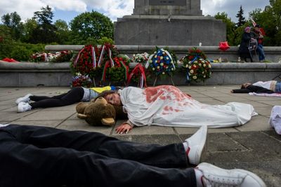 Activists Hold 'Die-in' Protest At Soviet Monument In Warsaw
