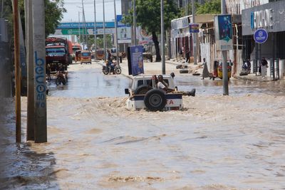 At least seven people die as heavy rains leave waist-high floodwaters in Somalia's capital