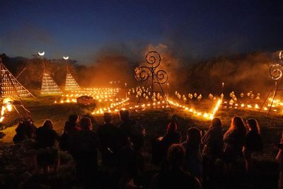 Spectators gather for ancient Celtic fire procession that welcomes summer