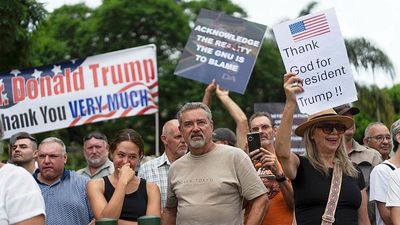 Dozens of white South Africans granted refugee status under Trump's new rule