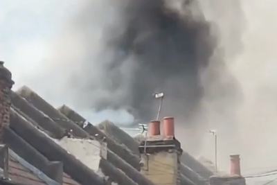 Huge fire rips through homes next to London Tube station