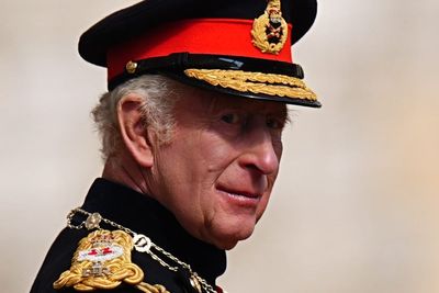 King speaks of ‘global uncertainty’ as he presents new standards to regiments