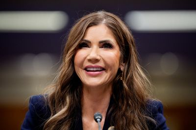 Kristi Noem faces angry protesters as she collects doctorate at South Dakota university