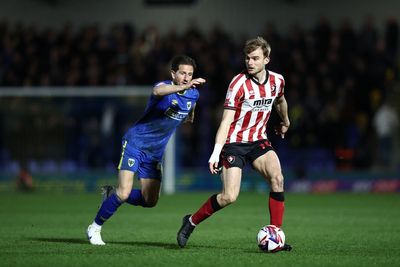 AFC Wimbledon's Sam Hutchinson undergoes surgery after suffering 'complications' during game