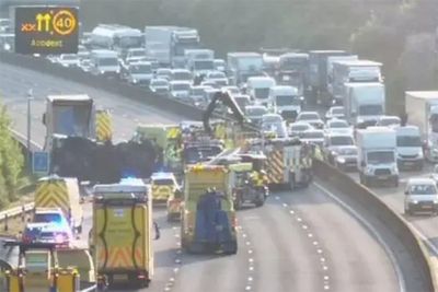 Severe delays on M25 and sections closed after waste lorry overturns