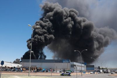 Residents told to close windows as huge fire sends black smoke across Spanish city