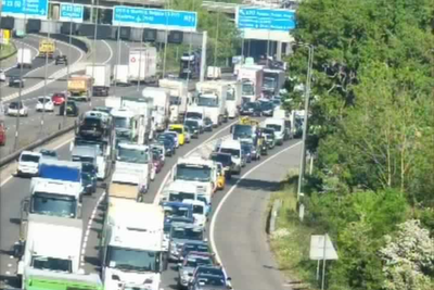 Two arrested after lorry overturns and spills waste in M25 crash
