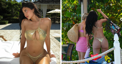Netizens Suspicious As Kylie Jenner Flaunts Round Butt In A Revealing Golden Bikini