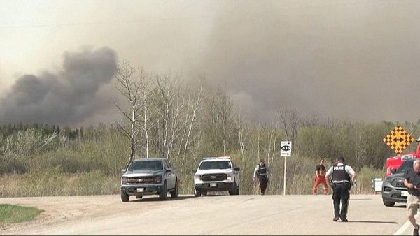 Police say two people were killed in massive wildfire in central Canadian province of Manitoba