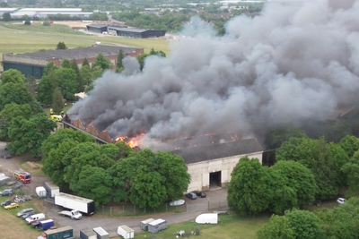 Two firefighters and member of public dead after large fire at ex-RAF base