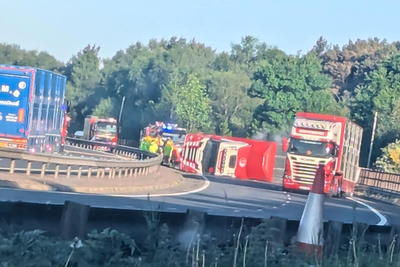 Motorway closed as rescue operation begins to free 40 cows trapped in overturned lorry