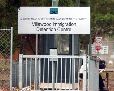 Man charged over stabbing two workers transporting him from detention centre to Sydney airport