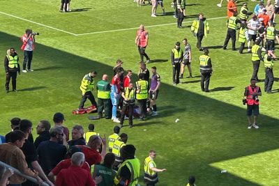 Aberdeen player left with head injury after his own fans threw a chair