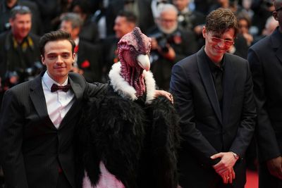 Bird man on red carpet leaves Cannes squawking