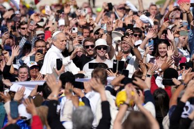 Pope Leo XIV greets tens of thousands from popemobile ahead of historic Vatican inauguration