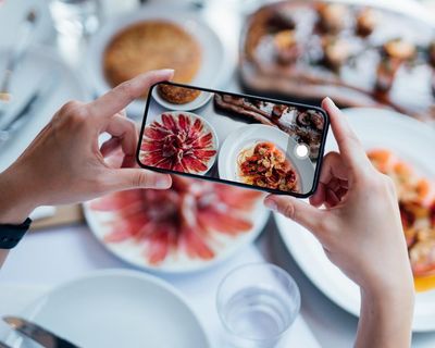 Should phone-obsessed diners be forced to stop scrolling? Not if restaurants want to stay open