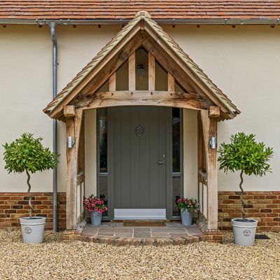 Debating between uPVC and timber for your porch? I asked the experts what the real difference is, and if one is actually better than the other