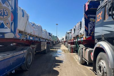 Live updates: A UN official says 20 aid trucks with food are waiting to enter Gaza
