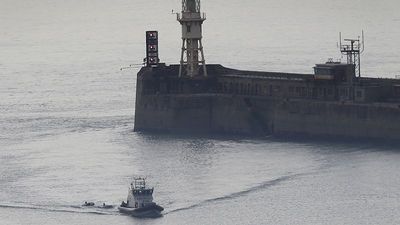 One dead and scores rescued after migrant boat sinks off coast of France