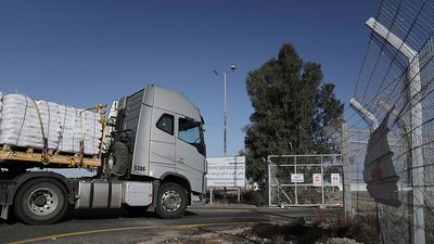 First aid trucks enter Gaza as allies warn Israel of sanctions