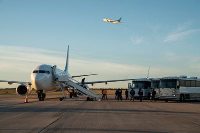 Trump Admin Conducts First Flight For Dozens Of Self-Deporting Migrants, Gives Them '$1,000 Stipend'