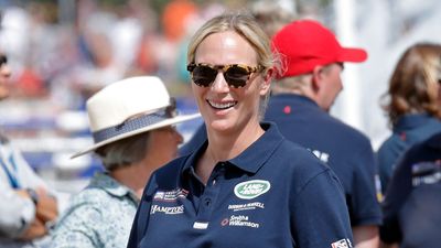 Zara Tindall looked effortlessly polished in white jeans and sleek sneakers - and expertly styled a pop of Barbie pink