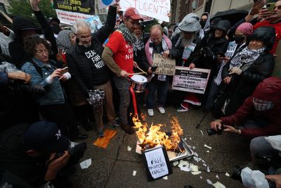 Pro-Palestine protesters burn diplomas and clash with police at Columbia graduation