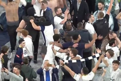 Spurs fans climb up giant screens to celebrate Europa League victory over Man Utd
