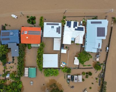 NSW flooding: PM delivers climate crisis warning as flood-hit region braces for strong winds and fifth body found