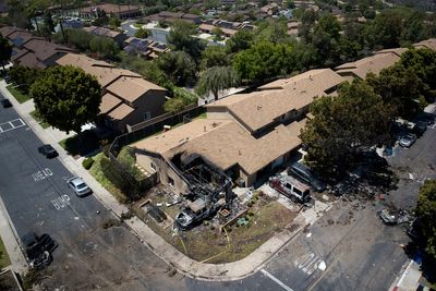 AP PHOTOS: Jet crashes into San Diego neighborhood, killing 3 and setting homes and vehicles on fire