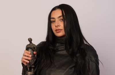 Charli xcx quips 'I am hardly Bob Dylan' as she's crowned Songwriter of the Year at The Ivor Novello Awards