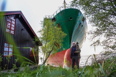 A Norwegian man awoke to find a grounded cargo ship had narrowly missed his home