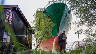 Norwegian man wakes to find cargo ship in his garden along Trondheim Fjord coast
