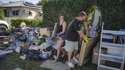 Flood-weary regions brace for high winds amid clean up