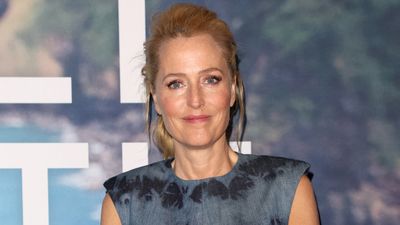Gillian Anderson channels Hollywood glamour in this royal-approved designer, her dress is the perfect look for smart summer occasions