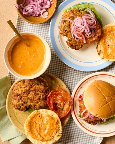 Honey & Co’s recipes for smashed chicken burgers and grilled asparagus salad