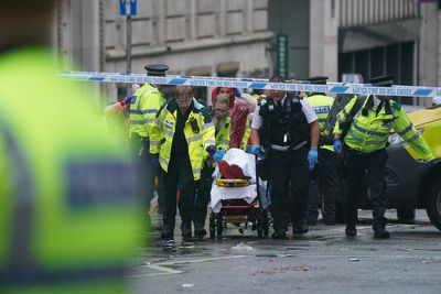 Man detained after car collides with pedestrians during Premier League parade