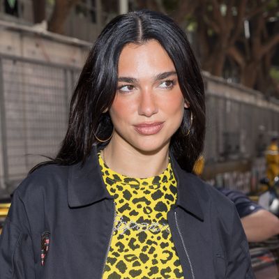 Dua Lipa Styles Her Favorite $100 Sneakers With Coperni Boyfriend Jeans and a Leopard Print Top