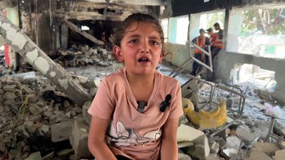 Silhouetted by fire, six-year-old girl survives Israeli attack in Gaza