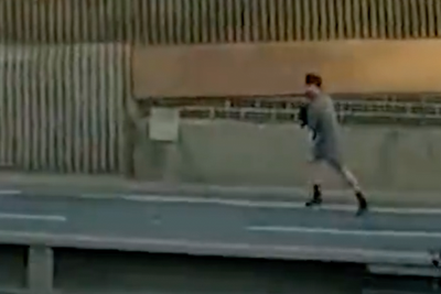 Watch: Dramatic moment police chase suspect down dual carriageway on foot