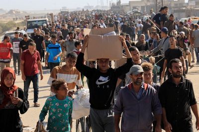 Deadly chaos at Gaza aid site as thousands rush for food and Israeli troops fire warning shots