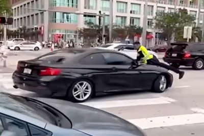 Shocking video shows cop on the hood of a moving car before shooting suspect