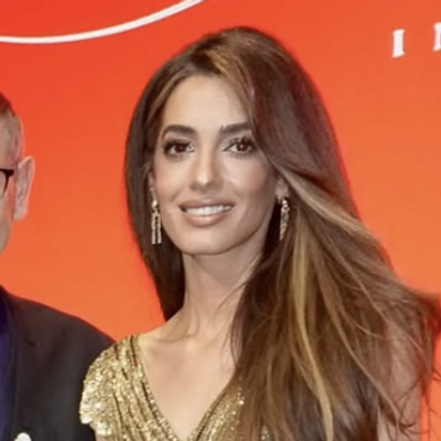 Amal Clooney Channels Cartier Gold in a Glistening Impact Awards Gown